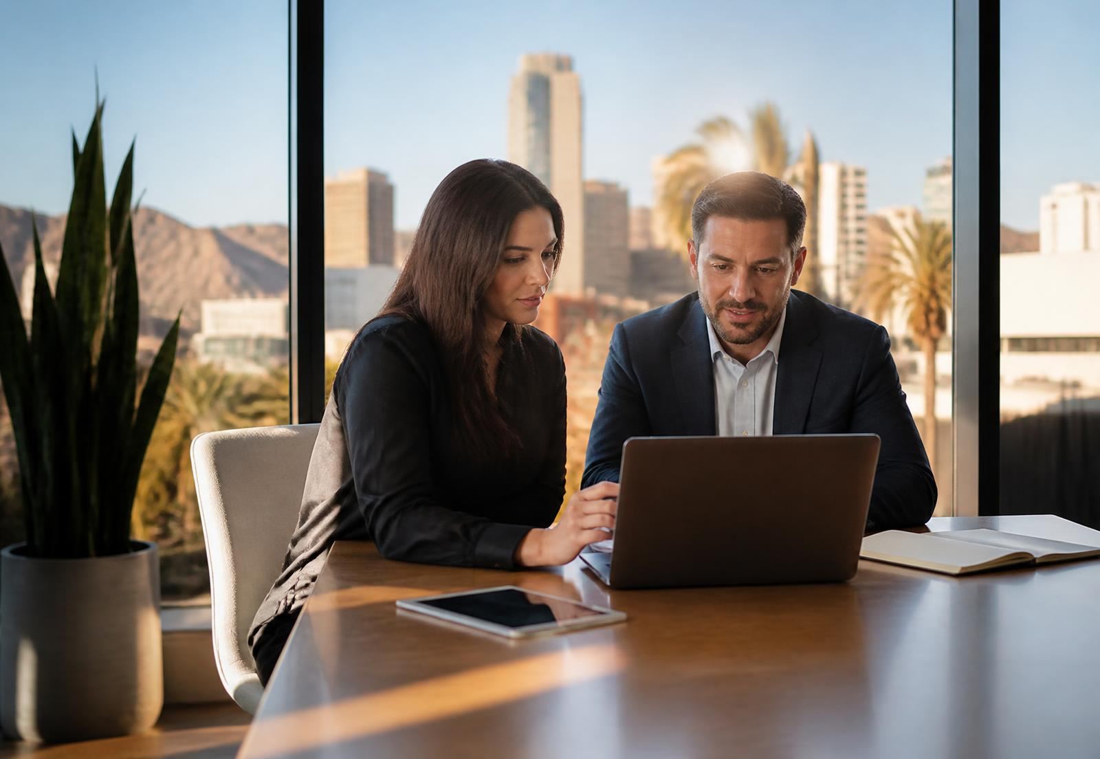 Consultants reviewing online reputation analytics in a Phoenix, Arizona office